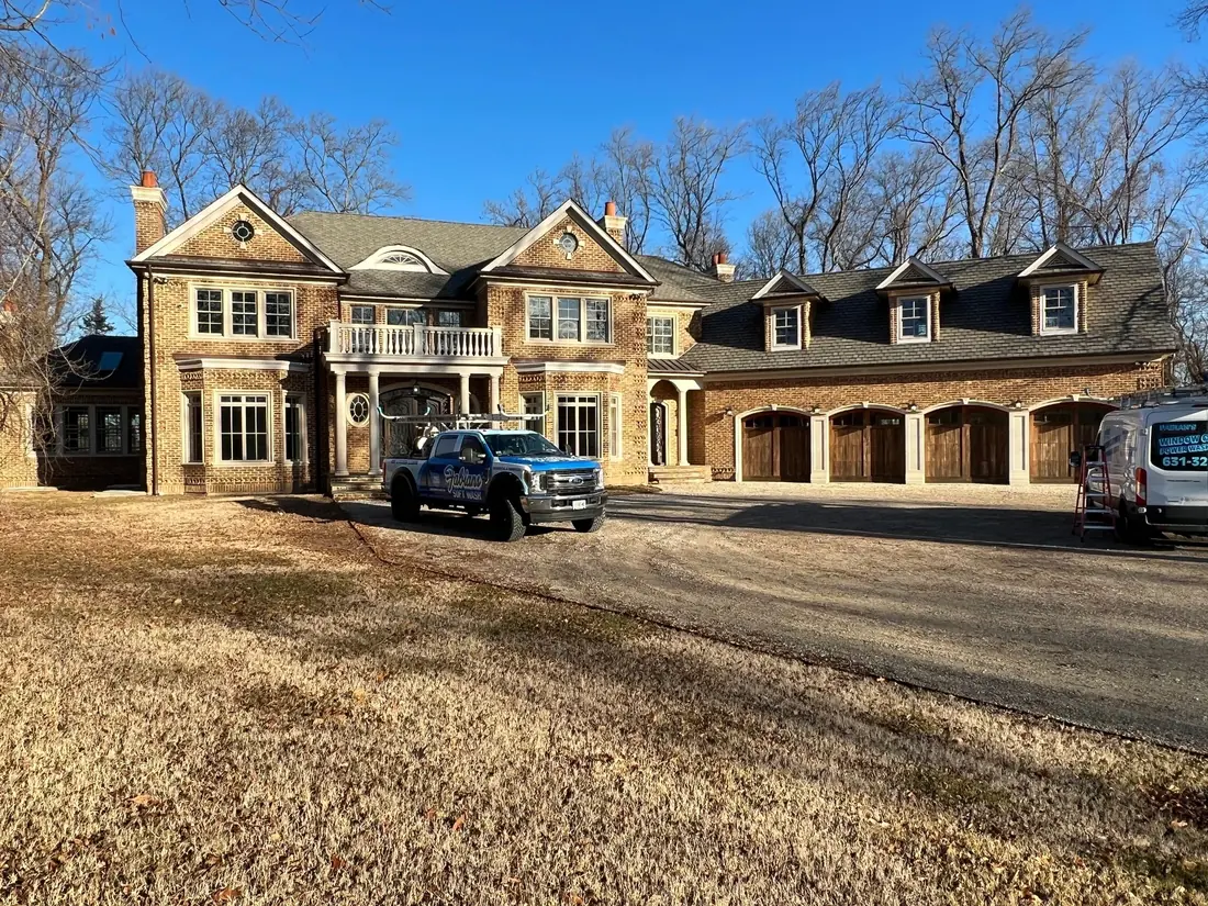 Fabian’s truck at a large stone home