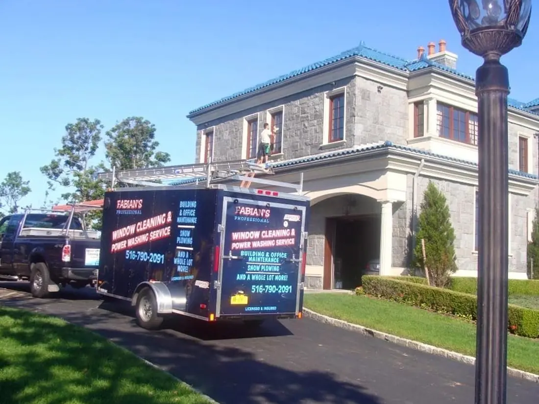 Fabian’s trailer at a home with a blue roof